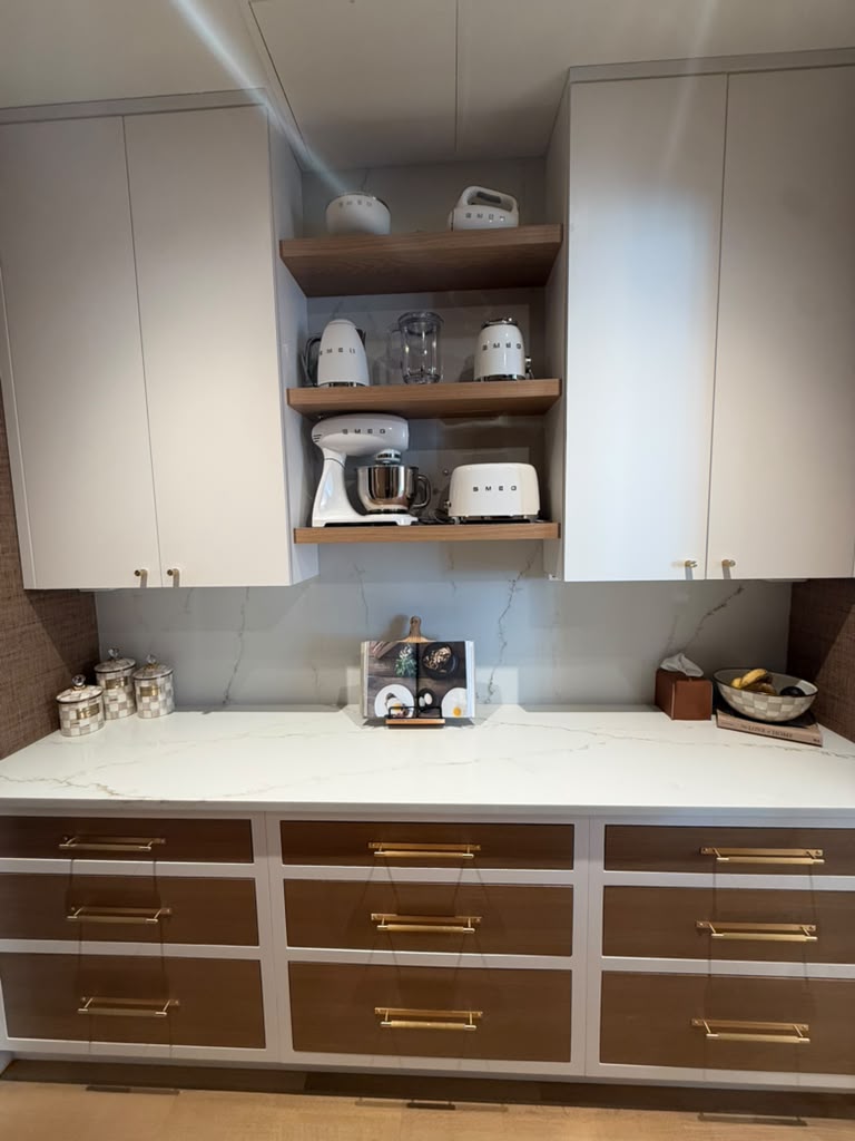 Butler's pantry with open walnut shelving and a curated SMEG appliance collection